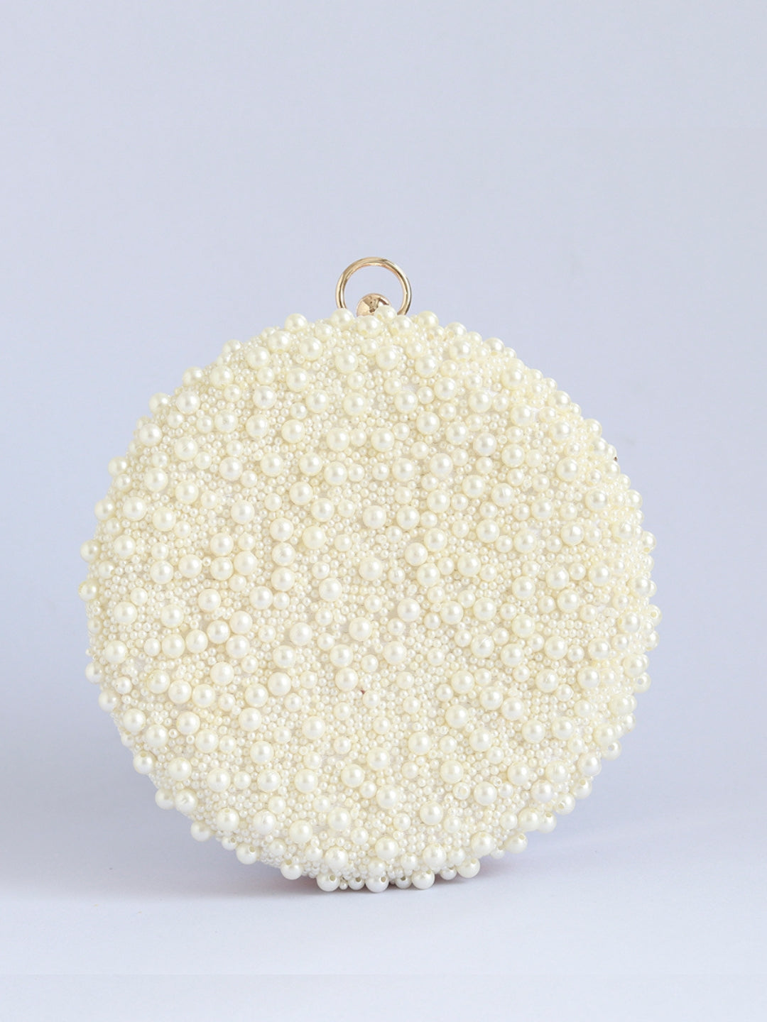 White pearl hand-embroidered clutch bag with intricate detailing, designed by Gauhar for The Tan Clan.