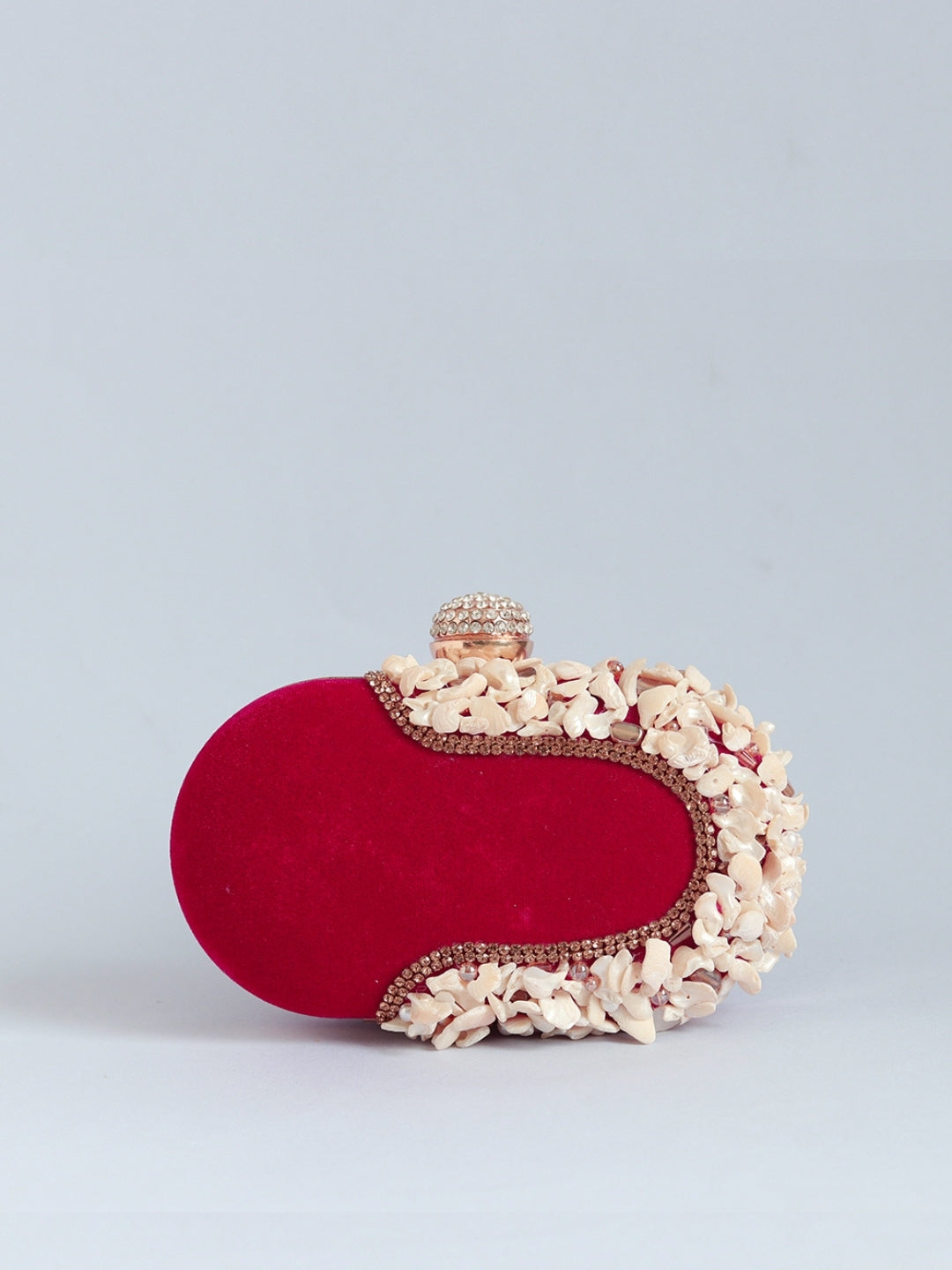 Dariya sea shell embroidered clutch bag by The Tan Clan featuring intricate hand embroidery and a compact design.