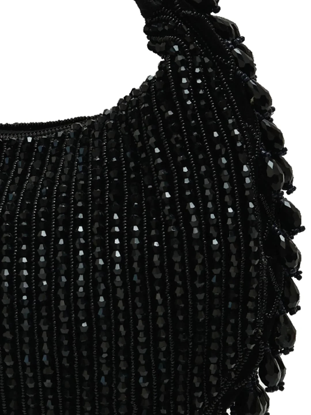 Close-up of a black beaded garment on a white background