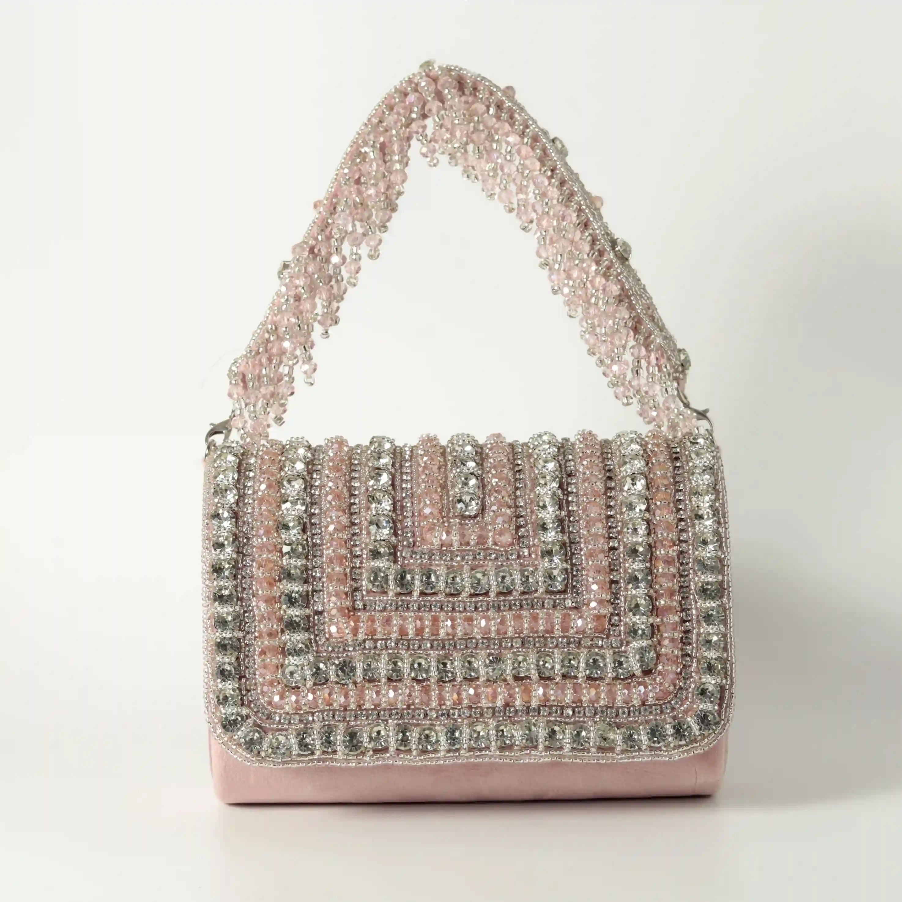 Nysa embellished flap-over clutch bag by The Tan Clan with metallic accents and a sleek design, perfect for evening accessories.