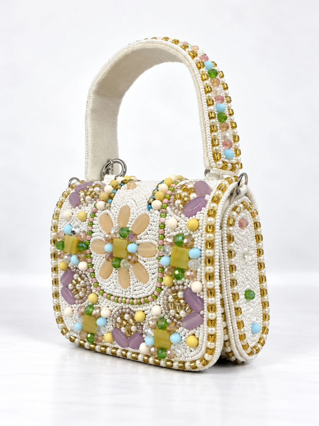 White hand-embroidered mini flap bag by THE TAN CLAN featuring intricate craftsmanship and elegant design.