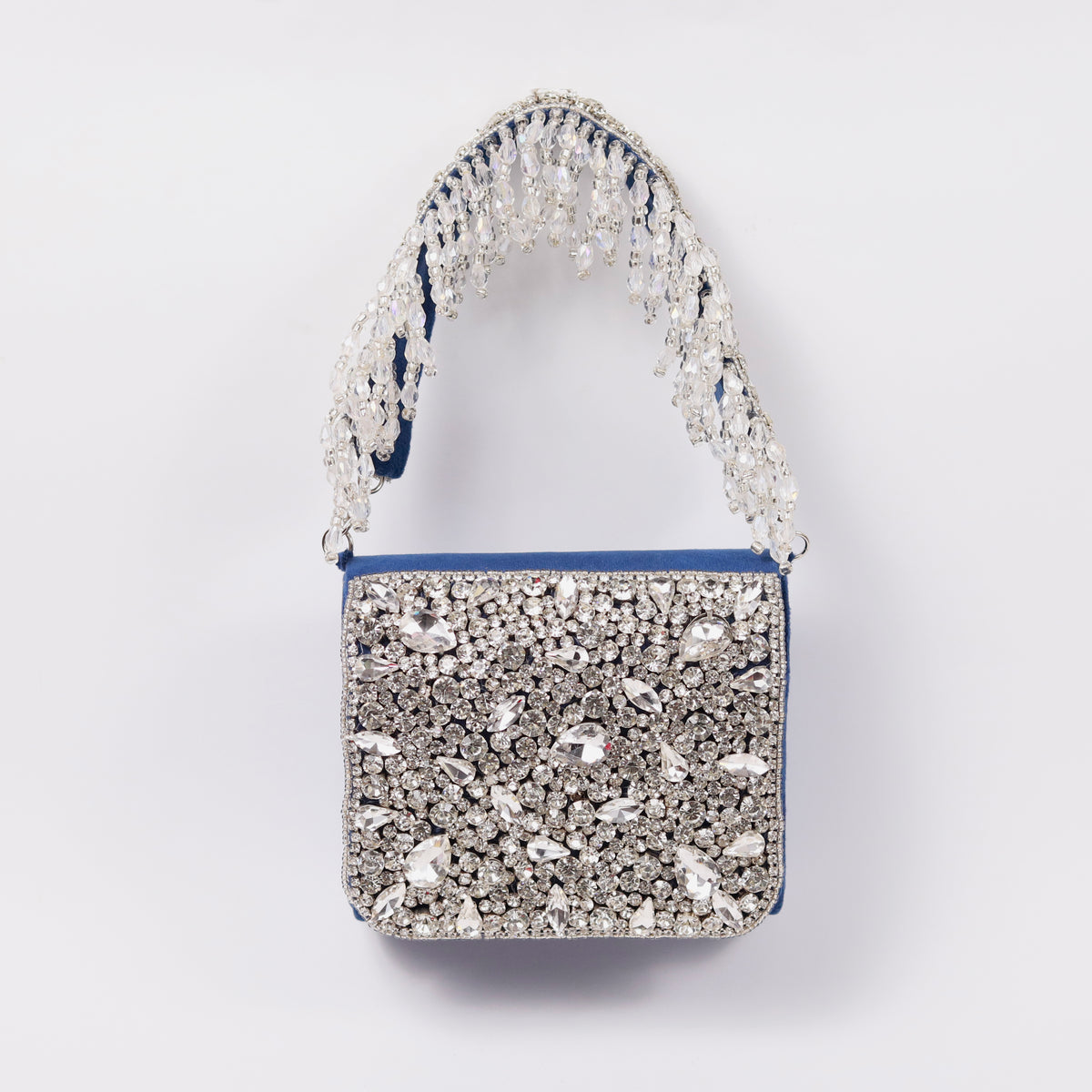 Grace mini bag from The Tan Clan with embroidered handle, featuring a compact design and stylish detailing.
