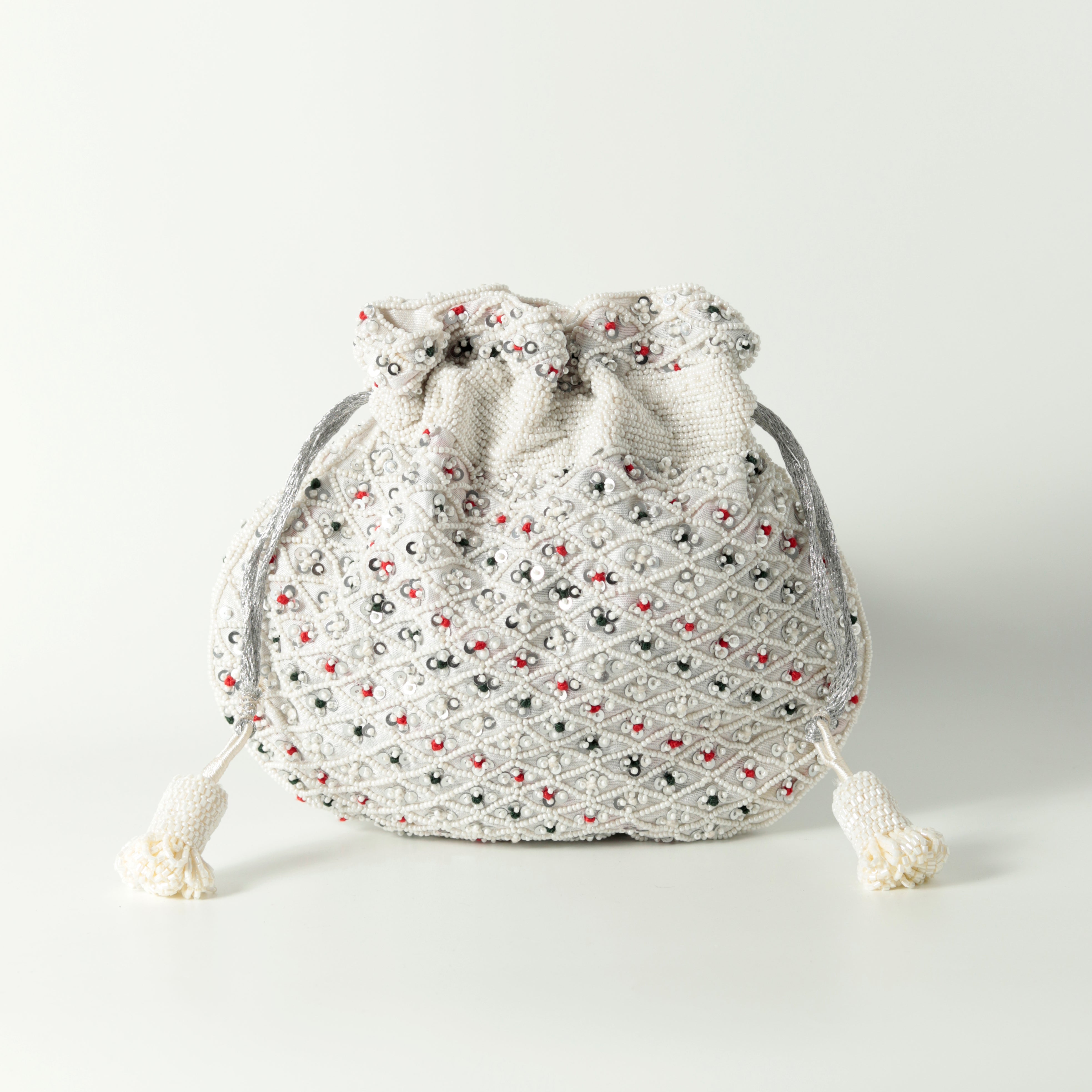 Shubhra Potli bag with handle by The Tan Clan, featuring intricate embroidery and traditional design for elegant occasions.