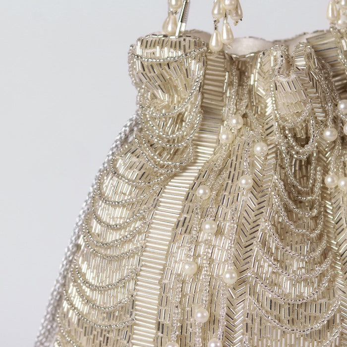 Noor Combo- Noor Mother of Pearl Clutch and Sharda Silver Potli Bag