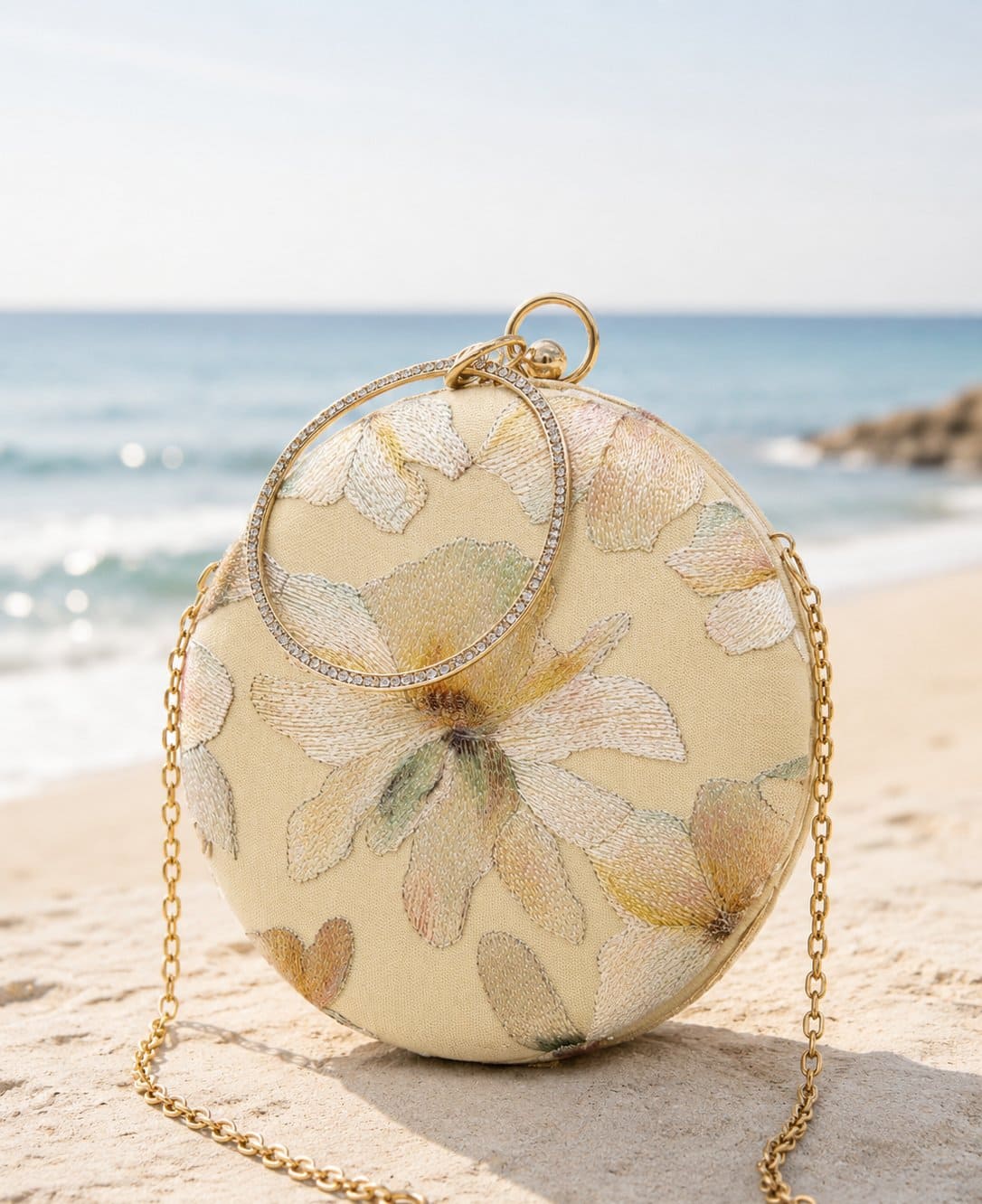 Yellow embroidered clutch bag with floral design from The Tan Clan, featuring a compact and elegant style.