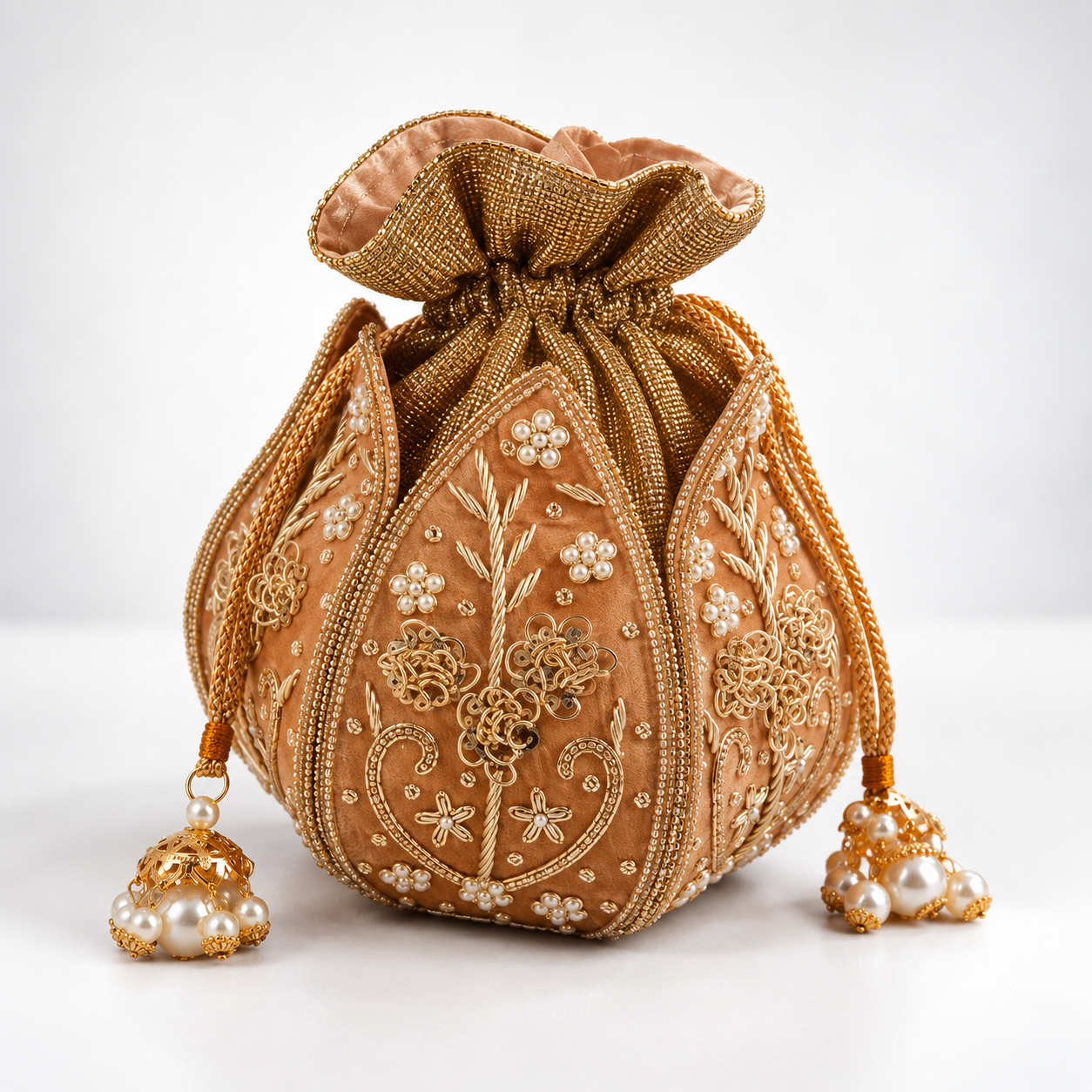 Mini lotus-shaped potli bag with Pushp Zardozi embroidery by The Tan Clan, featuring intricate floral embroidery and traditional design.