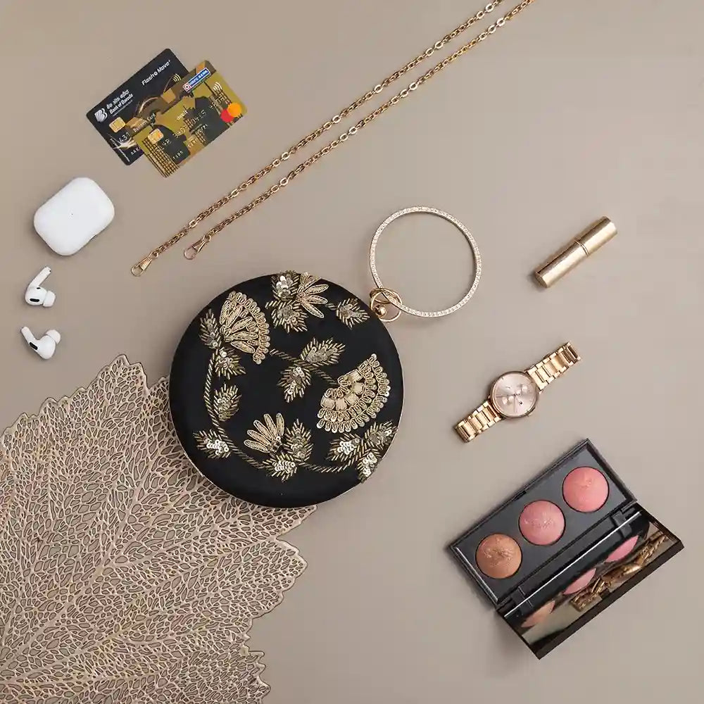 Rashida hand-embroidered clutch bag by The Tan Clan featuring intricate embroidery and a stylish compact design.