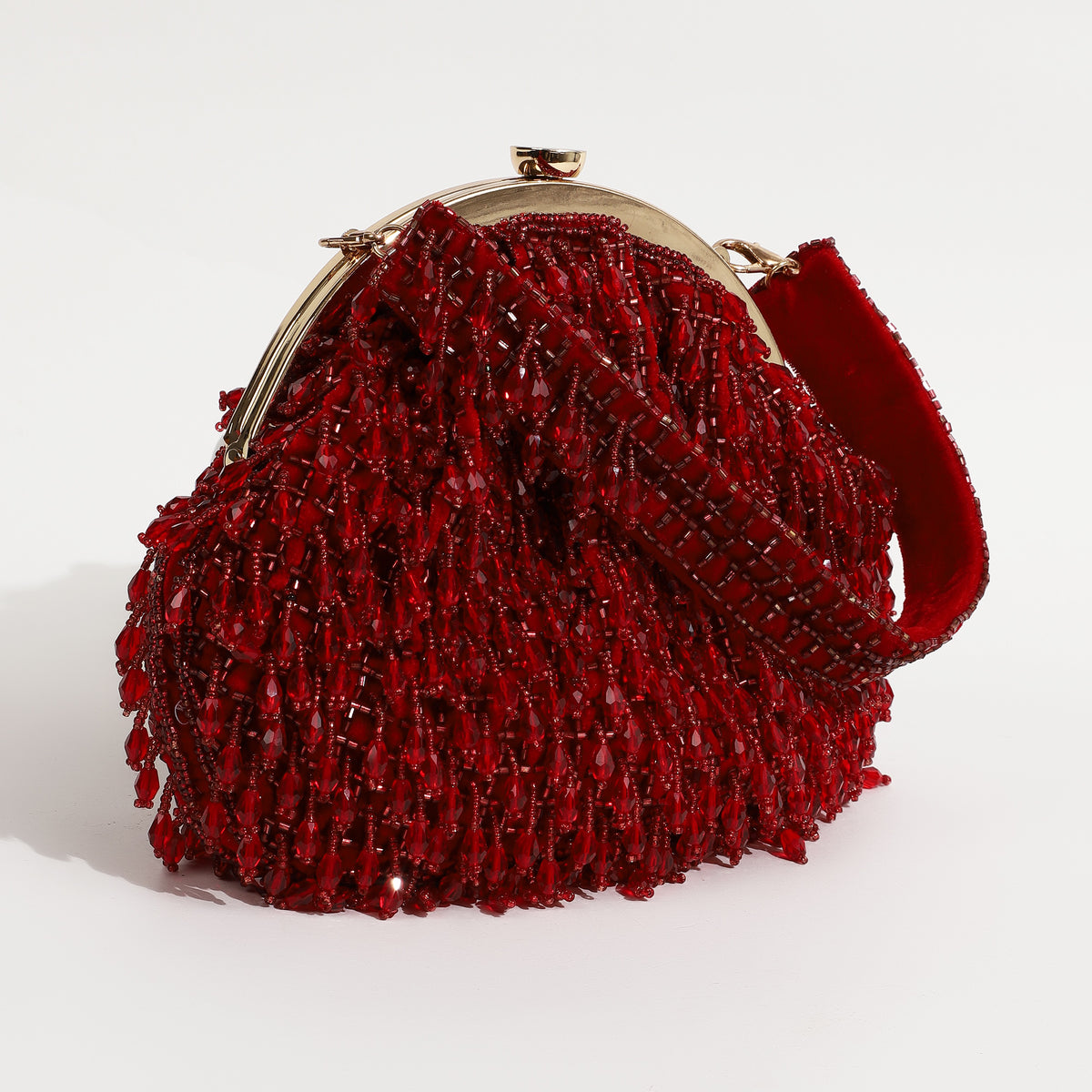 Red Rosa Batua bag with detachable handle by The Tan Clan, showing the stylish design and versatile strap on a plain background.