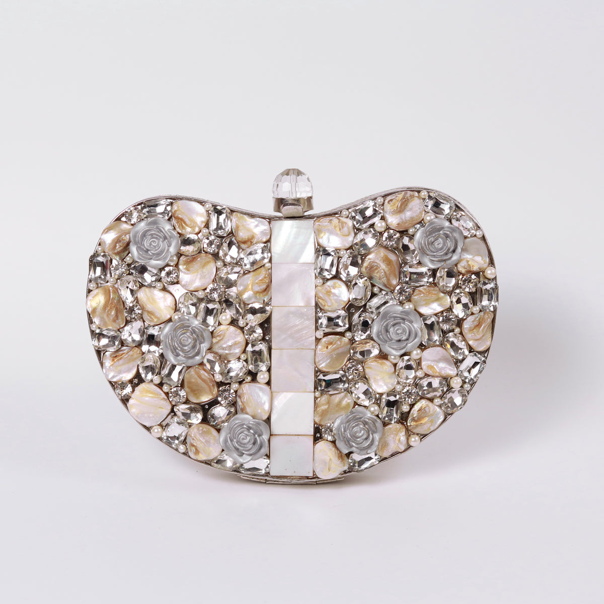 Silver Seher embellished brass clutch with intricate detailing, designed by The Tan Clan, showcasing a stylish and elegant accessory.