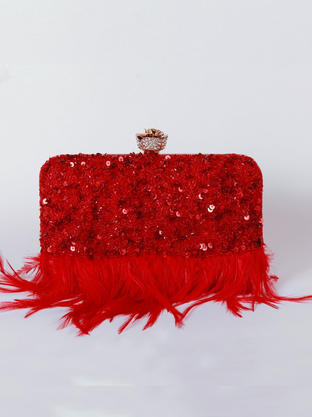 Red hand-embroidered feather clutch by The Tan Clan featuring intricate embroidery and a sleek, elegant design.
