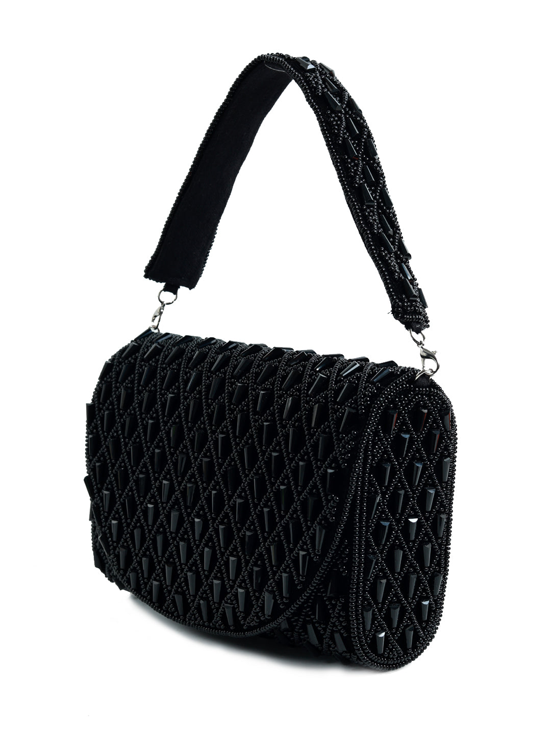 Black flap-over bag by The Tan Clan featuring a stylish design and spacious interior, perfect for everyday use.