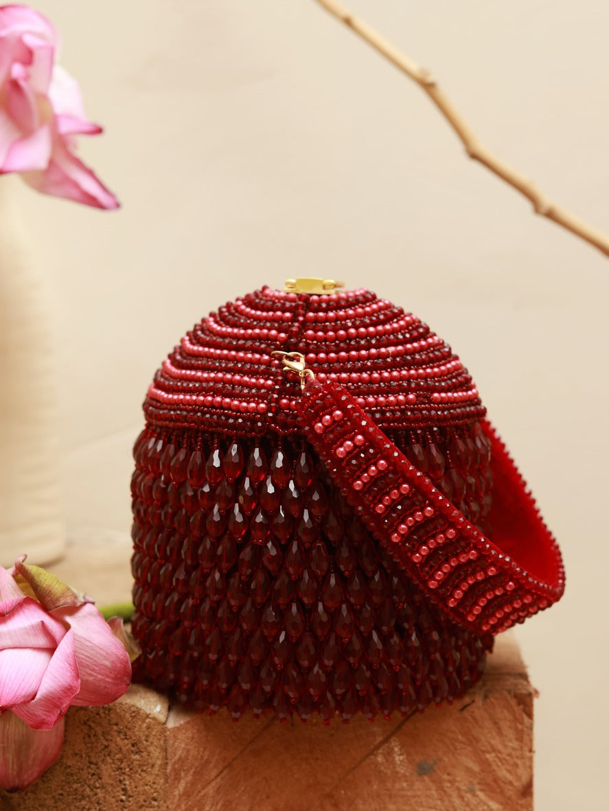 Emma round embellished bag with handle from The Tan Clan, featuring decorative details and a stylish design.