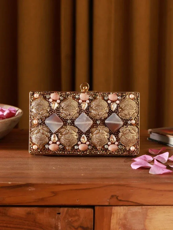 Arya embellished brass clutch from The Tan Clan featuring intricate designs and a sleek, elegant style for special occasions.