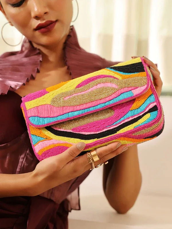 Multicolor Aster Baguette Bag with handle by The Tan Clan, featuring vibrant patterns and a compact, stylish design.