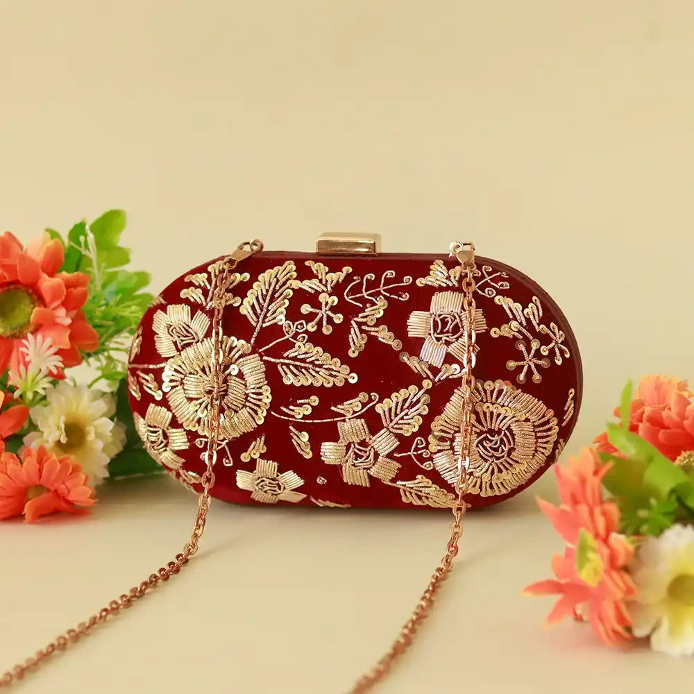 Elegant Begum Zardozi hand-embroidered clutch bag by The Tan Clan with intricate gold thread detailing and traditional design.