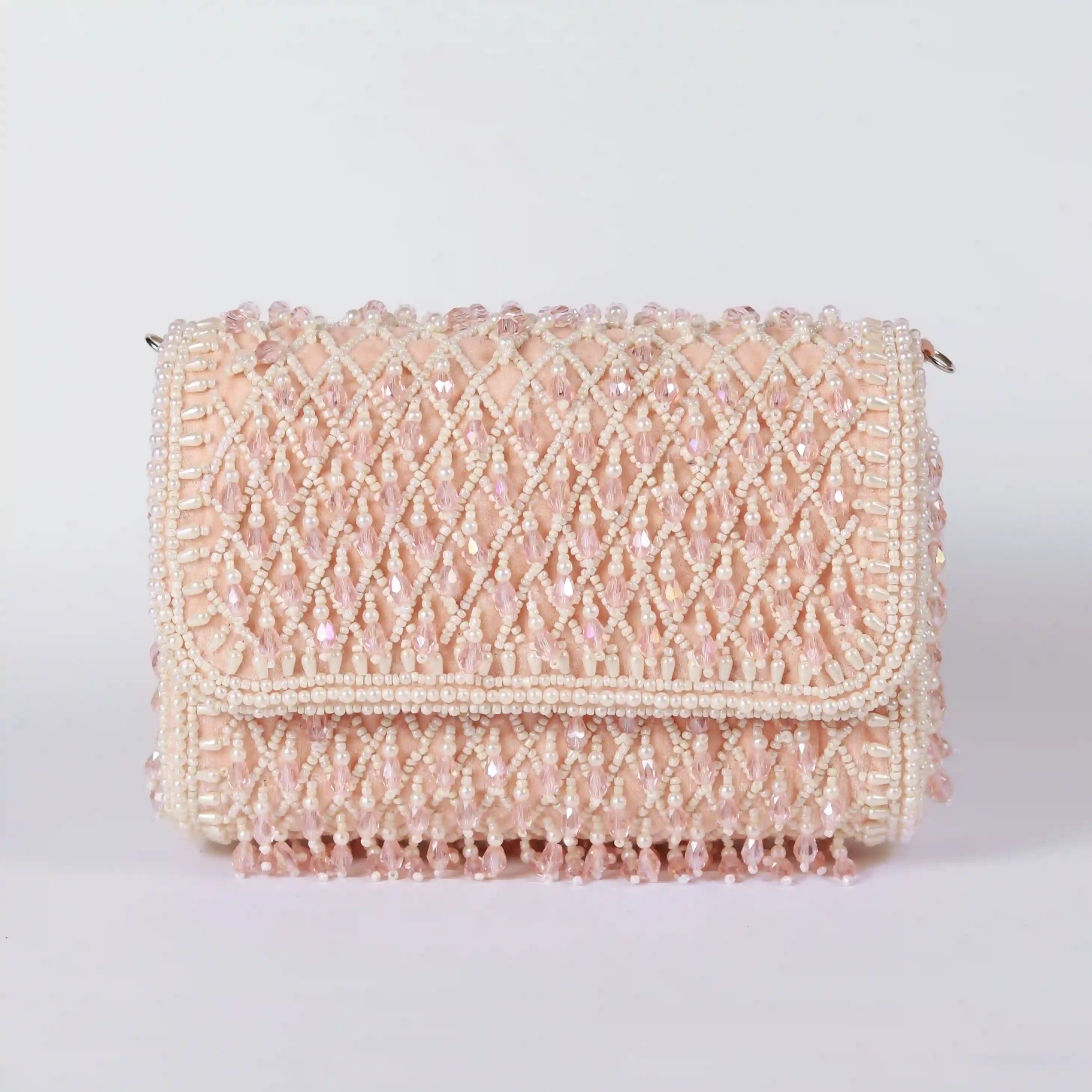 Blush flap over bag with handle from The Tan Clan, featuring a stylish design and compact size for everyday use.