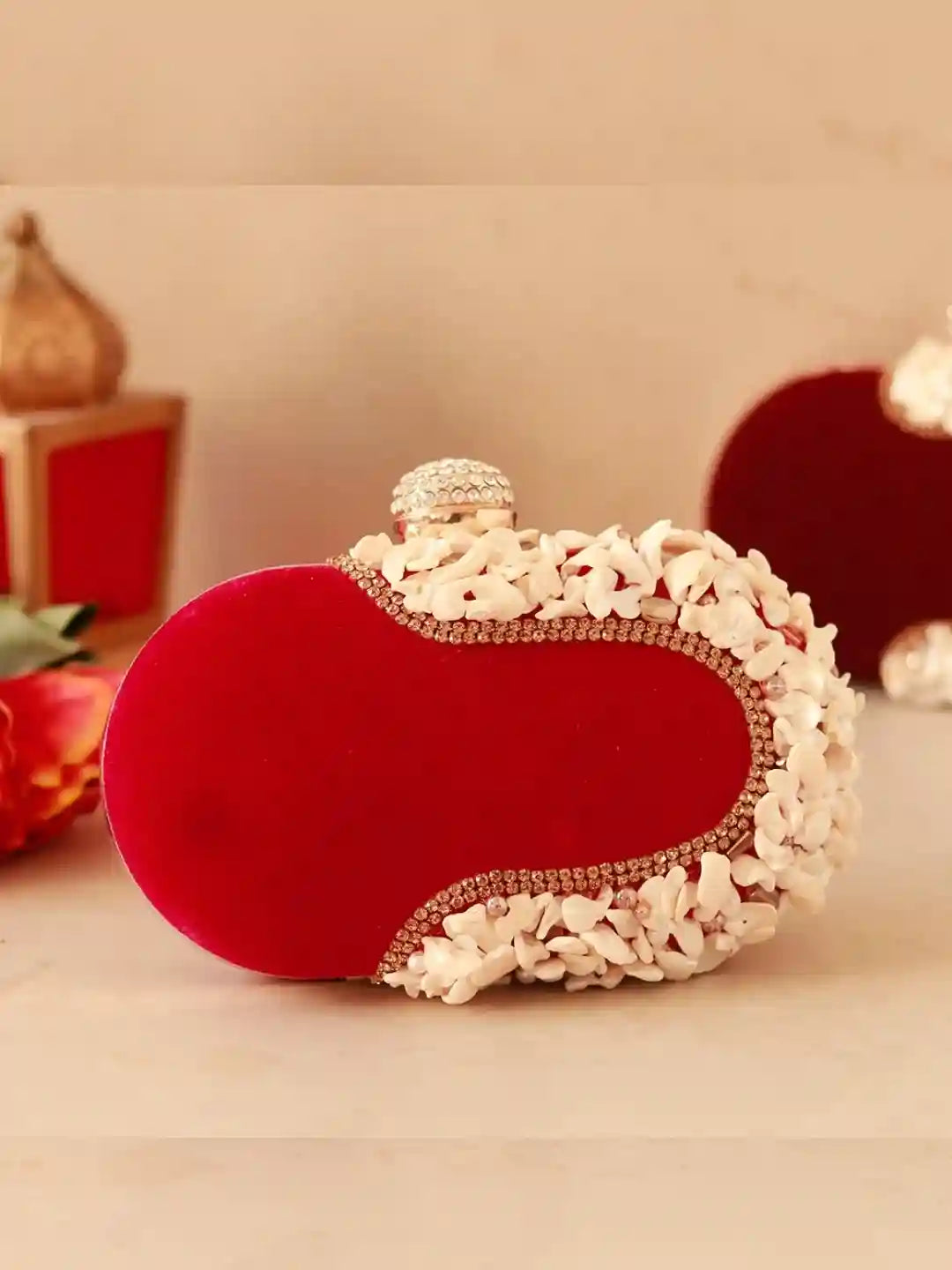 Dariya sea shell hand-embroidered clutch bag by The Tan Clan featuring intricate shell motifs and vibrant embroidery details.