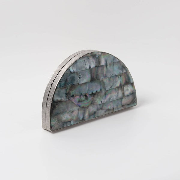 Eyan Mother of Pearl clutch purse by The Tan Clan with intricate pearl design and elegant rectangular shape.