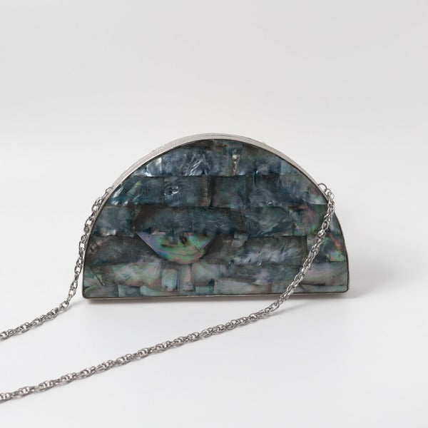 Eyan Mother of Pearl clutch bag by The Tan Clan with iridescent pearl finish and elegant design for evening accessories.