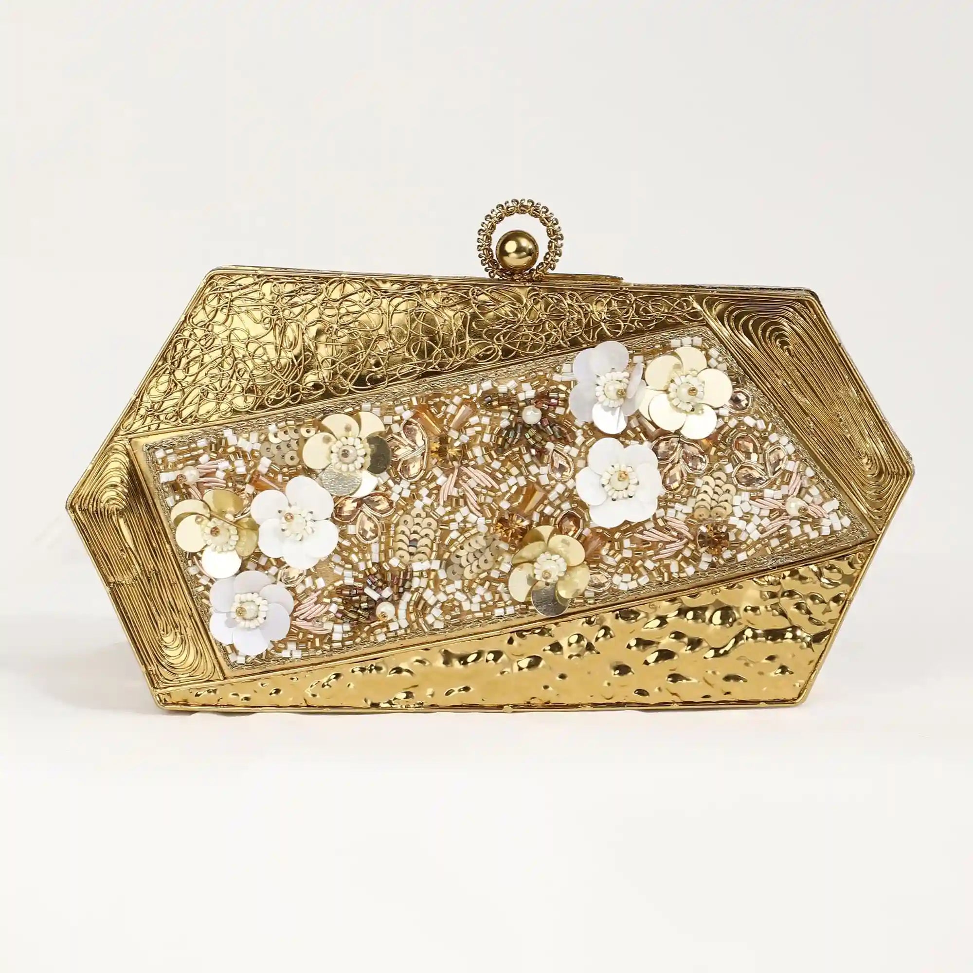 Gold brass clutch with intricate embellishments and detailed craftsmanship, featuring the Fatima design by The Tan Clan.