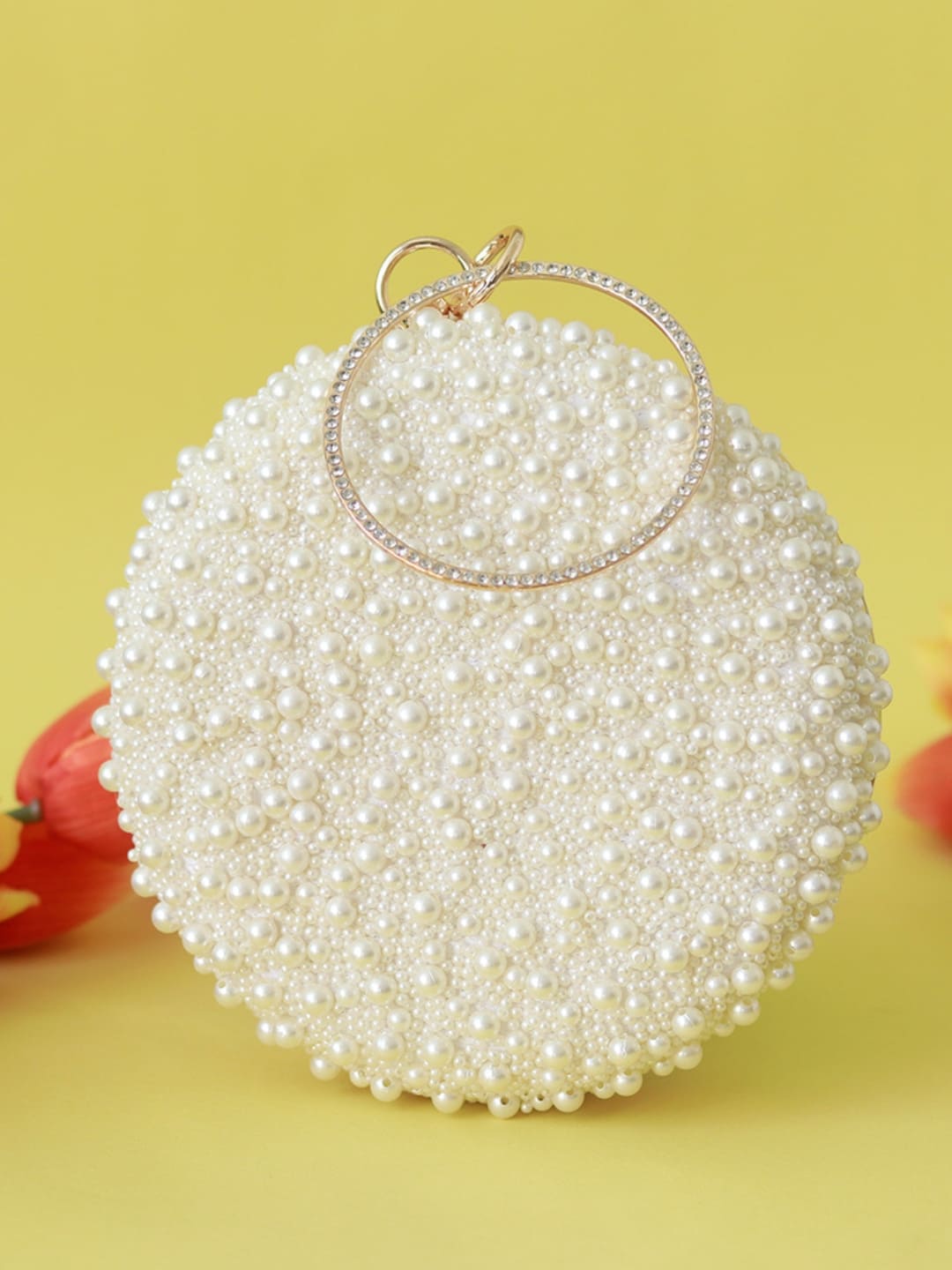 White pearl embroidered clutch with intricate hand embroidery, featuring elegant design by The Tan Clan.