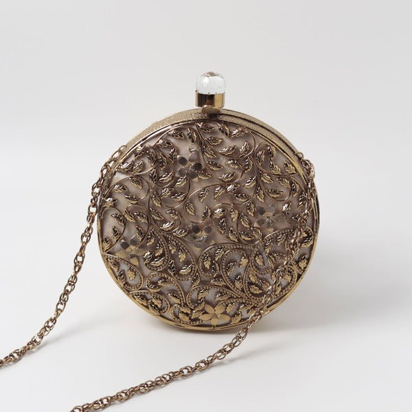 Intricate brass work with mother of pearl clutch bag by Gazal from The Tan Clan, showcasing detailed craftsmanship and elegant design.