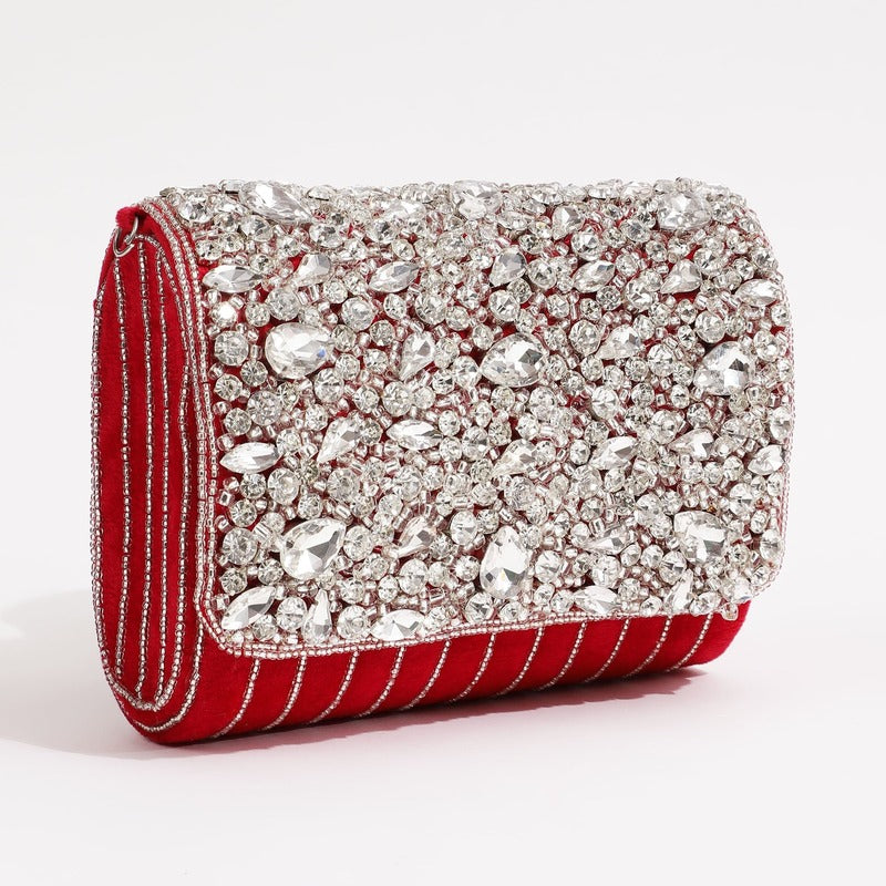 Red Grace Embellished Flap Over Bag by The Tan Clan with decorative embellishments and a flap closure.