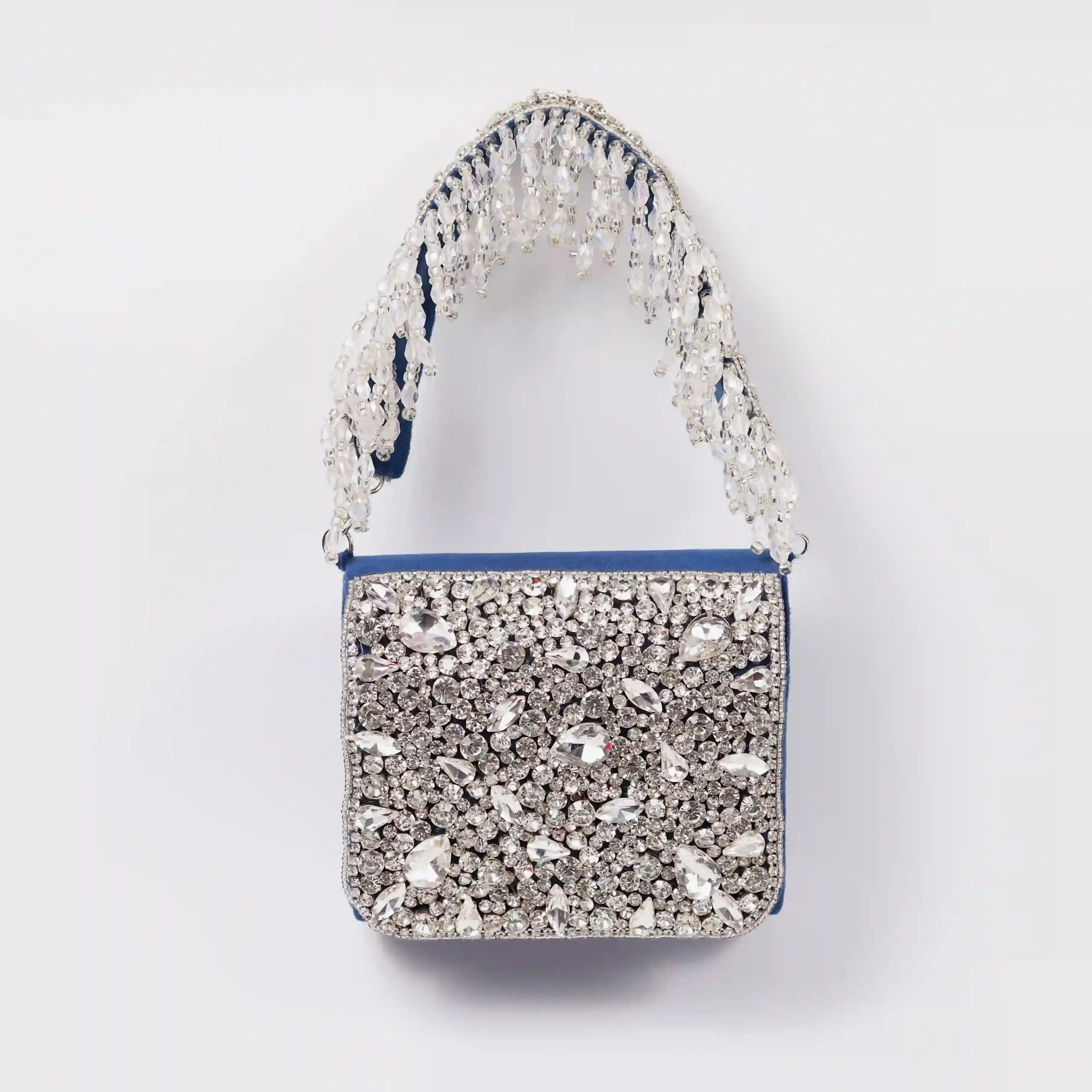 Blue Grace Mini Bag by The Tan Clan with a stylish embroidered handle and sleek design.