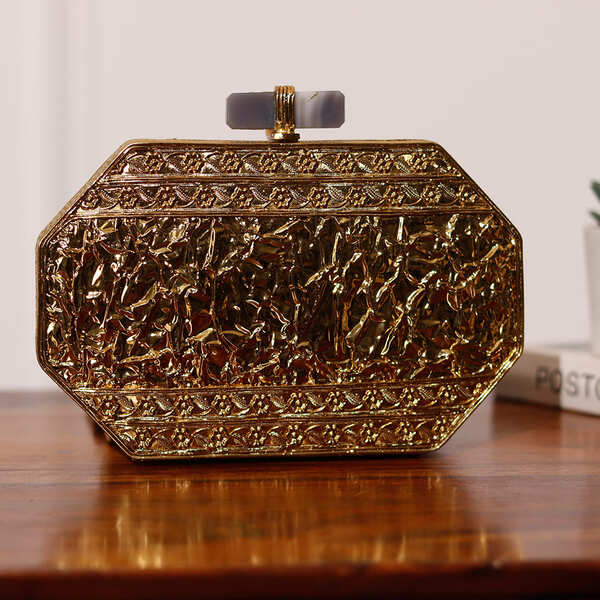 Inaayat Brass Mother of Pearl Clutch by The Tan Clan showing intricate brass and mother of pearl design with clasp closure.