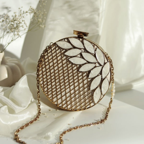 Intricate brass and mother of pearl clutch purse by The Tan Clan featuring detailed traditional craftsmanship.