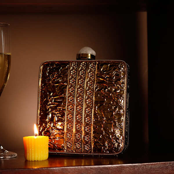 Liyana Mother of Pearl Clutch by The Tan Clan featuring a shimmering pearl exterior and elegant design for special occasions