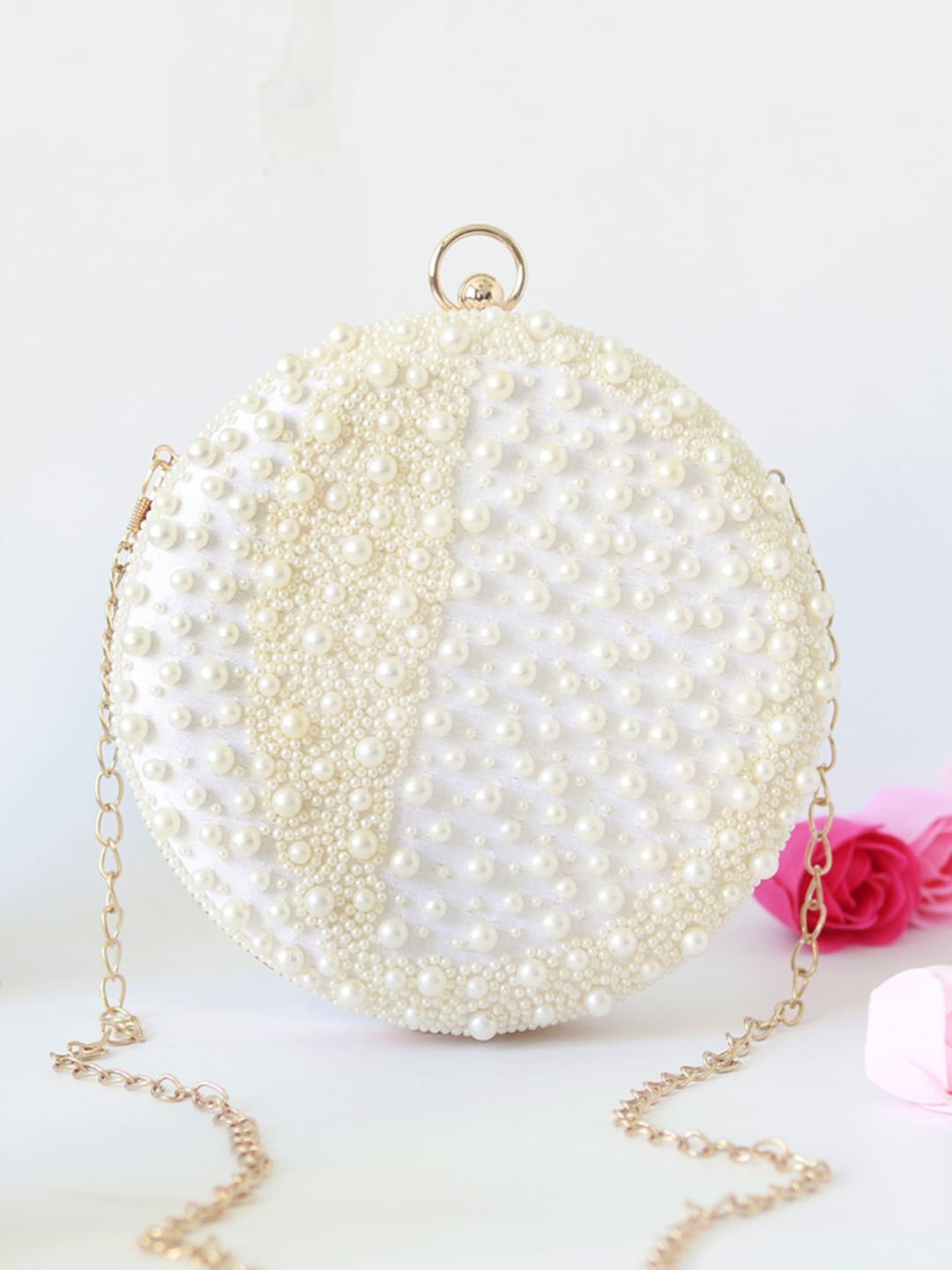 Mukta all-white pearl hand-embroidered clutch by The Tan Clan featuring intricate beadwork and elegant design.