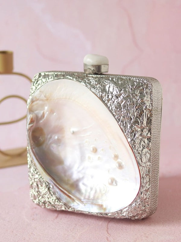 Mumtaz Mother of Pearl Clutch by The Tan Clan showing intricate pearl detailing and elegant rectangular design.