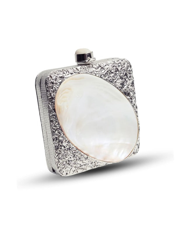 The Tan Clan Mumtaz Mother of Pearl Clutch with intricate pearl detailing and a sleek, elegant design.