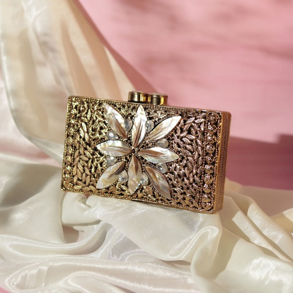 Nadia embellished mother of pearl clutch by The Tan Clan featuring intricate beadwork and a sleek, elegant design for evening use.