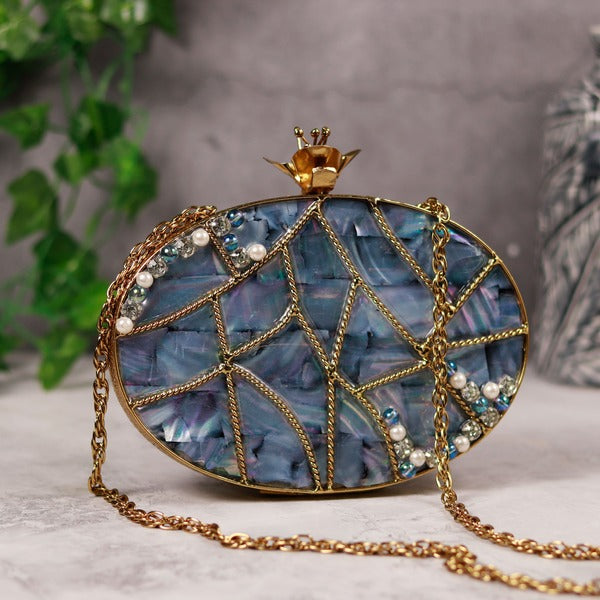 Nargis embellished mother of pearl clutch bag with intricate beadwork and decorative accents, designed by The Tan Clan.