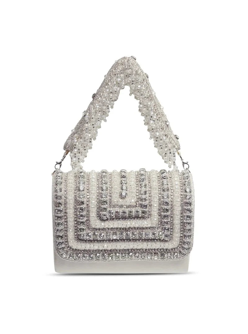 Nysa white embellished flap-over clutch bag by The Tan Clan with decorative details and a sleek design for elegant occasions.