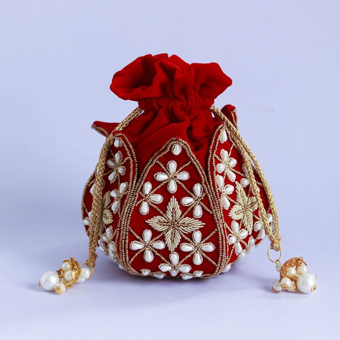 Pushya Hand Embroidered Mini Lotus Potli bag by The Tan Clan with intricate embroidery and a compact design.