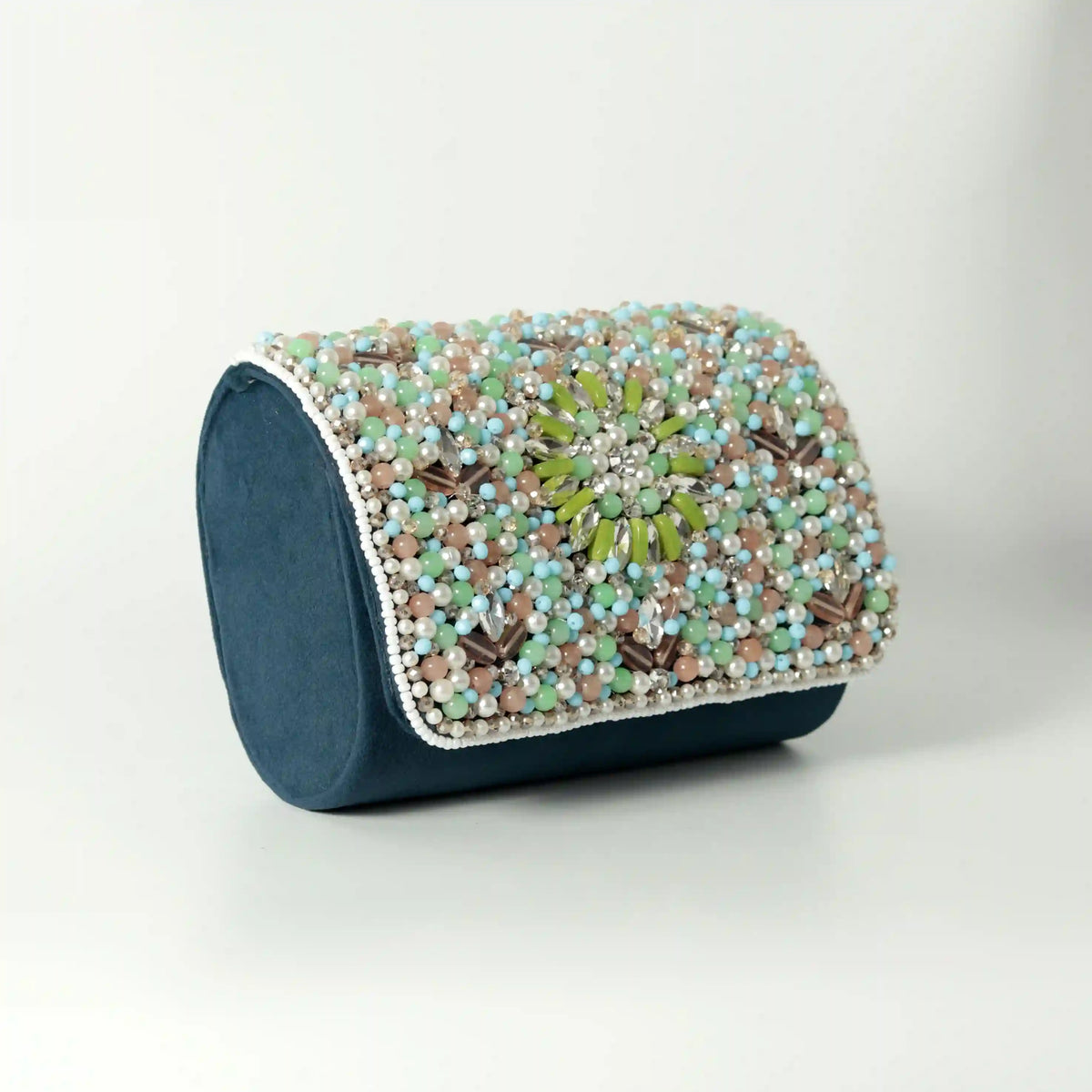 Rainbow embellished flap-over clutch bag by The Tan Clan featuring colorful rainbow accents and a sleek design.