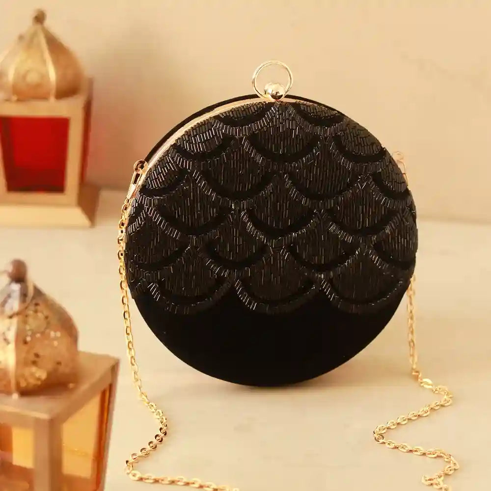 Hand embroidered Rajwada clutch by The Tan Clan showcasing intricate design and traditional craftsmanship.