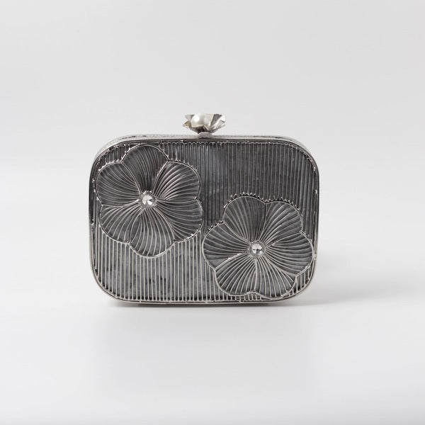 Reema silver brass wirework clutch bag with intricate detailing, designed by The Tan Clan for elegant evening use.