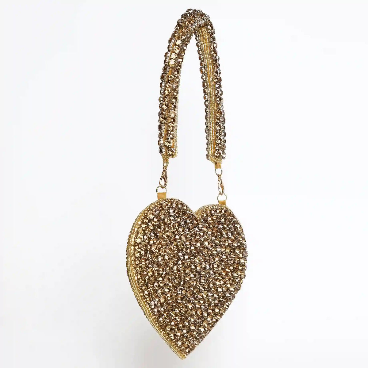 Scarlett Mini Heart Bag by The Tan Clan featuring a compact pink leather design with a gold chain strap.
