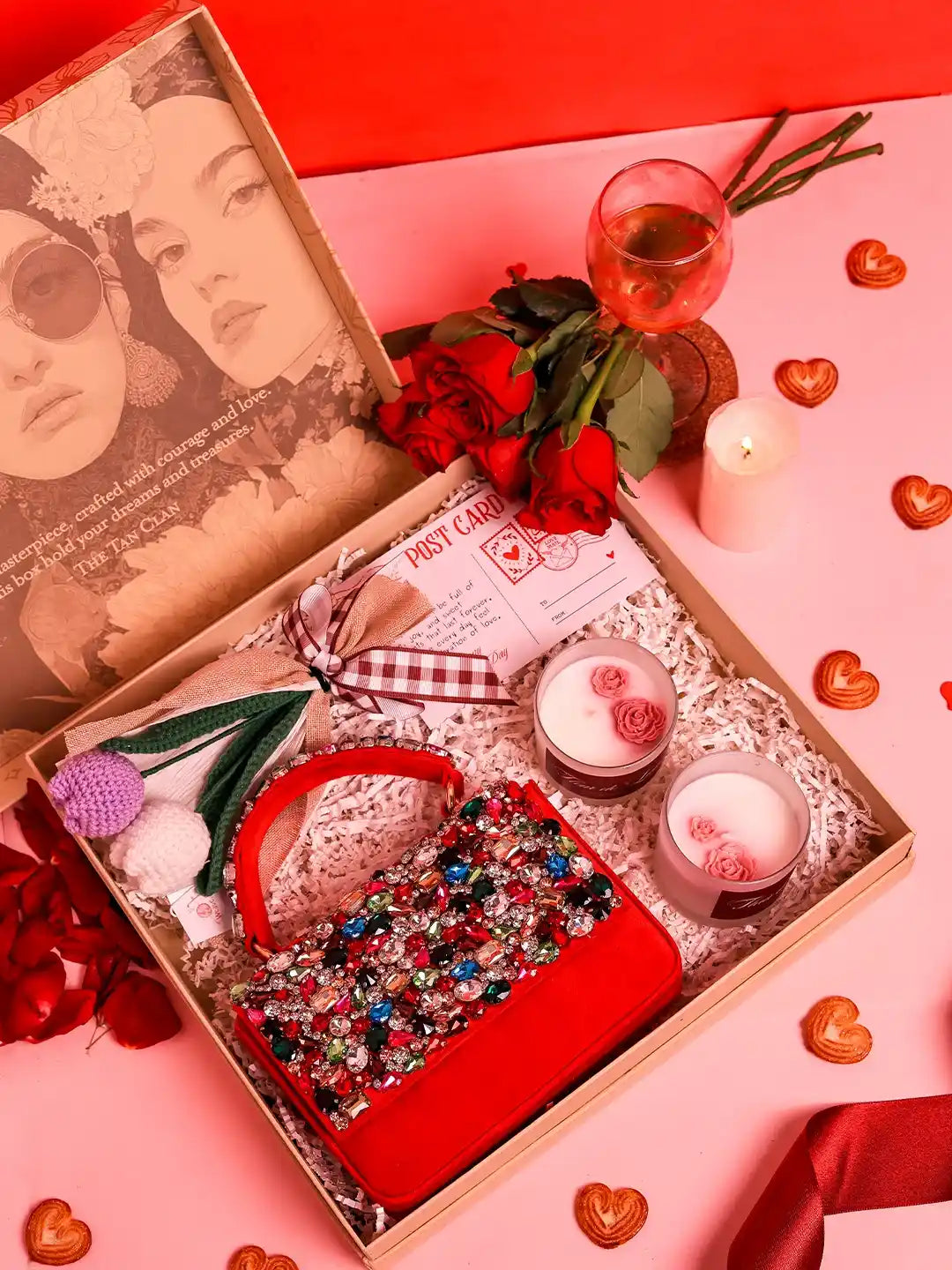 Soul-Care gift set featuring a Kylie clutch, candle, and flower, by THE TAN CLAN, arranged on a neutral background.