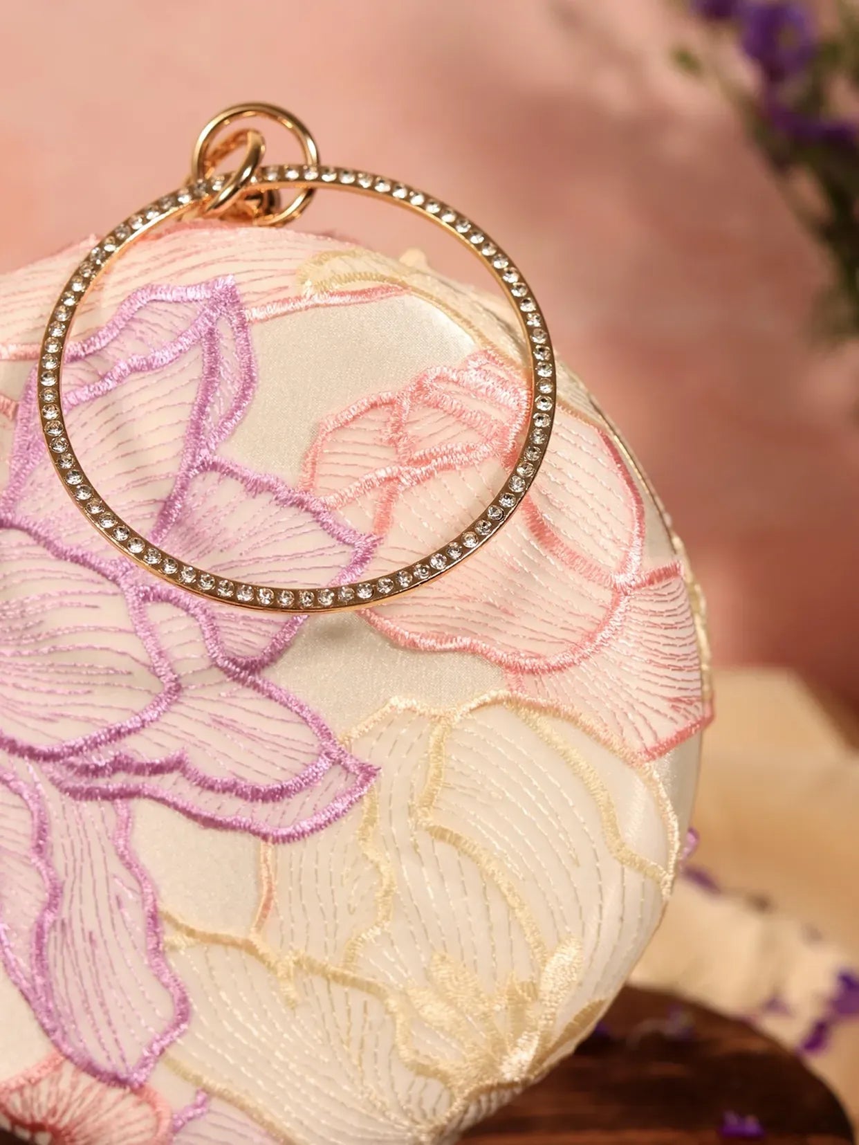 Pink round clutch bag by The Tan Clan with a smooth surface and compact design, perfect for stylish evening accessories.