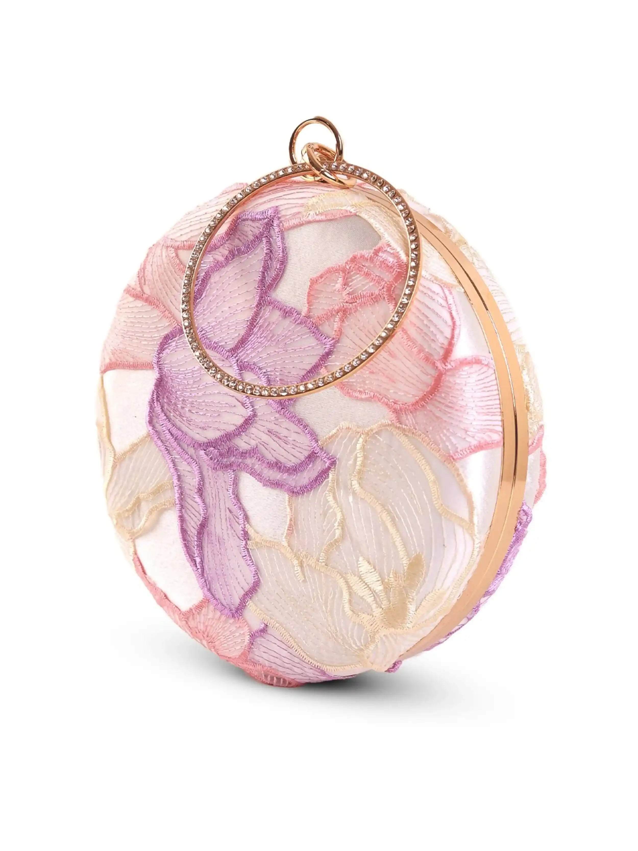 Pink round clutch bag by The Tan Clan featuring a sleek design and compact size, perfect for stylish accessories.