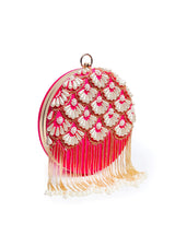 Round hand-embroidered clutch with tassels from The Tan Clan featuring intricate embroidery and stylish design.