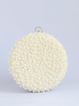 White pearl hand-embroidered clutch bag with intricate detailing, designed by Gauhar for The Tan Clan.
