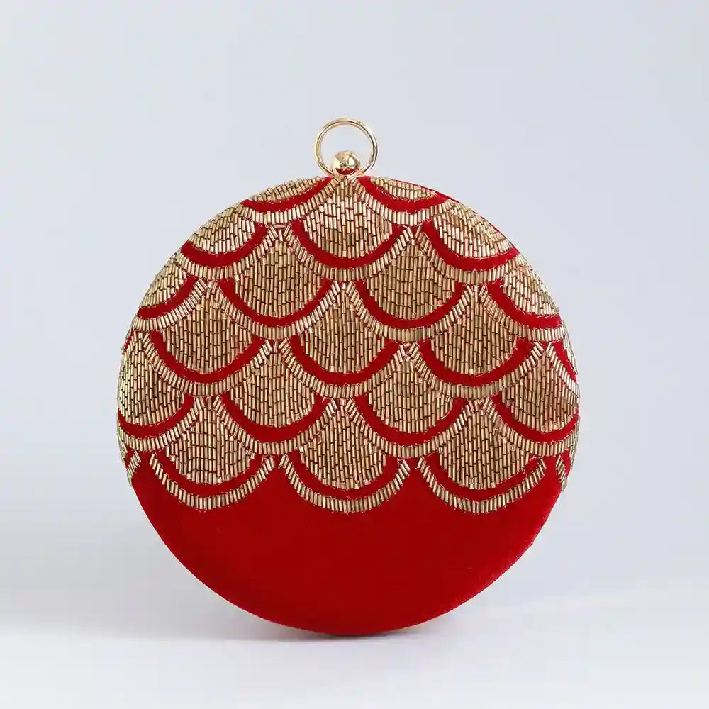 Hand embroidered Rajwada clutch bag by The Tan Clan with intricate traditional designs and a vibrant color pattern.
