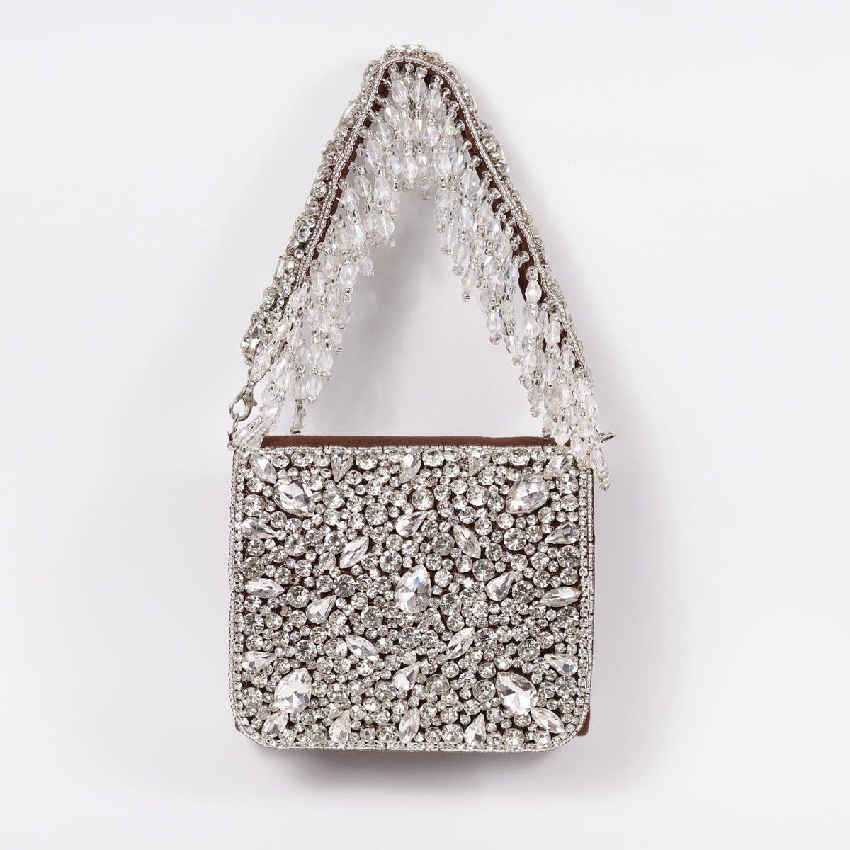 Grace mini bag by The Tan Clan featuring an embroidered handle, small handbag with detailed embroidery on the strap.
