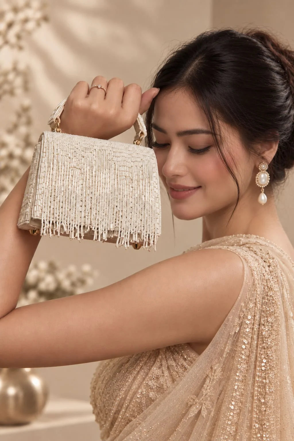 Maria White handcrafted beaded tasselled bag by THE TAN CLAN with intricate beadwork and tassel details, perfect for stylish occasions.